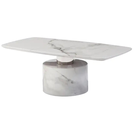 The Siren coffee table has a smooth white marble top supported by a cylindrical marble and polished stainless steel base, giving it a sleek and modern look.

A modern statement piece, this coffee table features a sleek round white marble top. The table has a cylindrical white marble base featuring a polished stainless steel support, elevating the elegance of the design.

Dimensions; H45 x L65 x W125